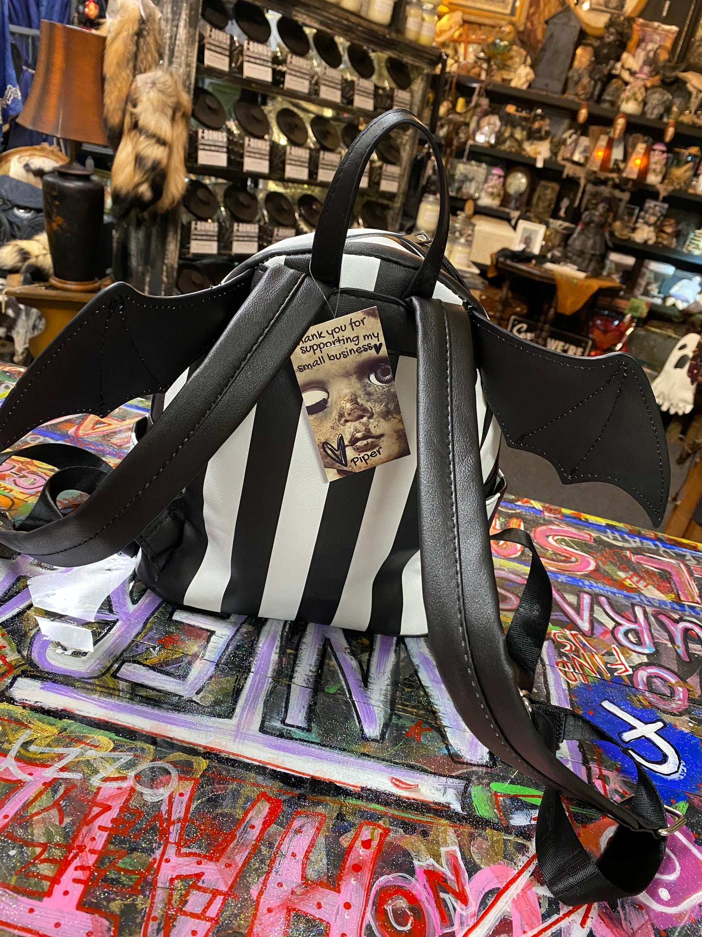 Black and white stripe bat wing backpack
