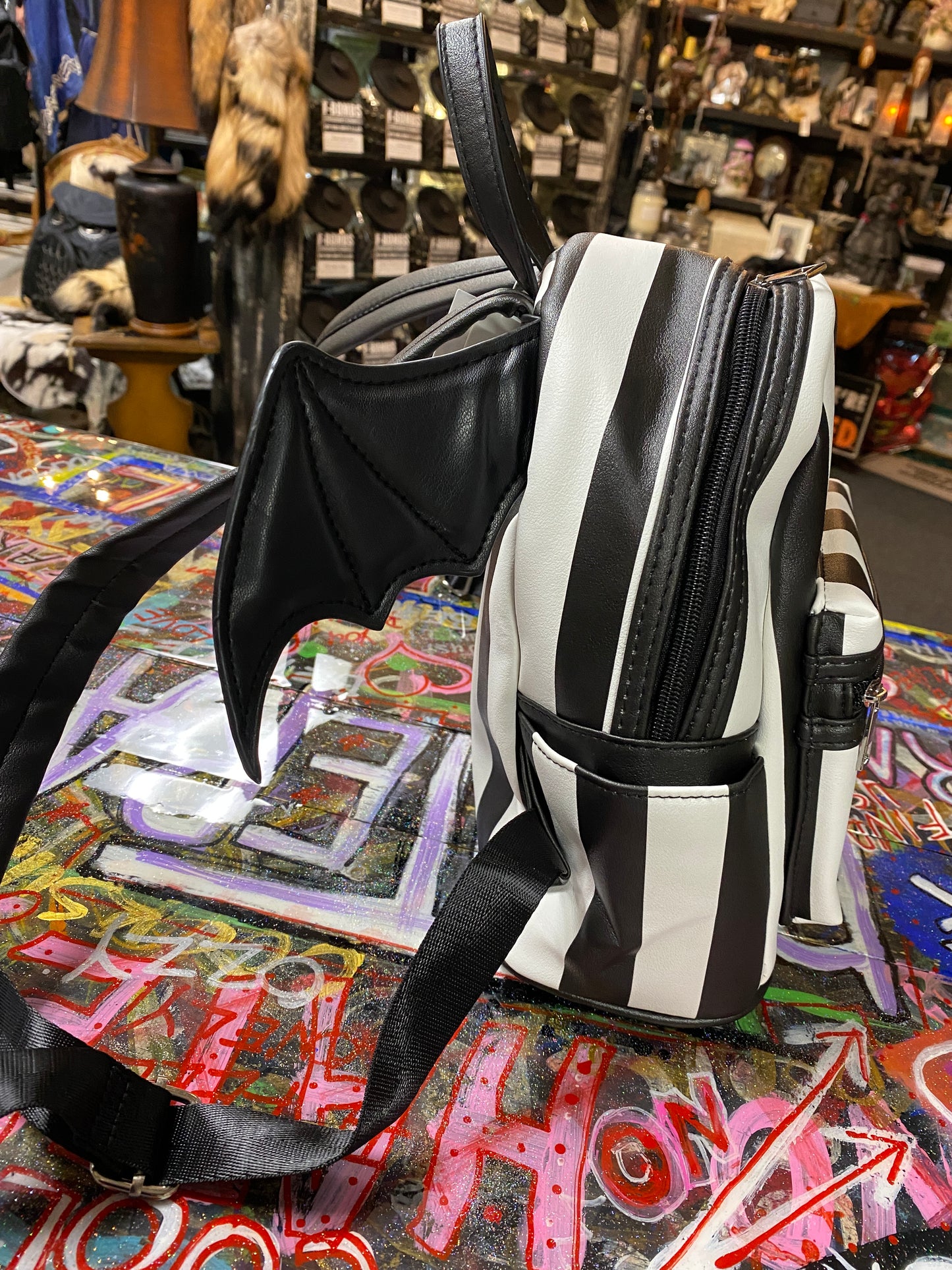 Black and white stripe bat wing backpack