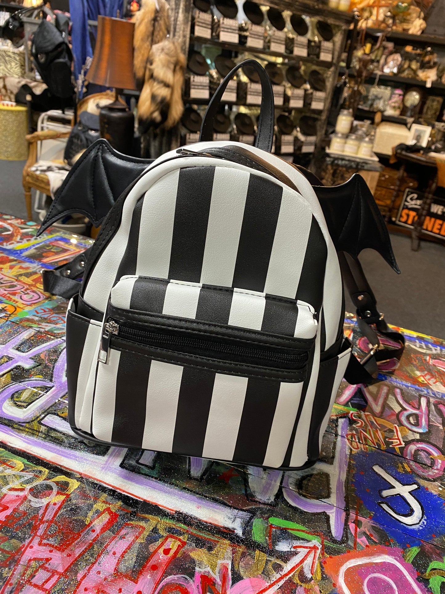 Black and white stripe bat wing backpack