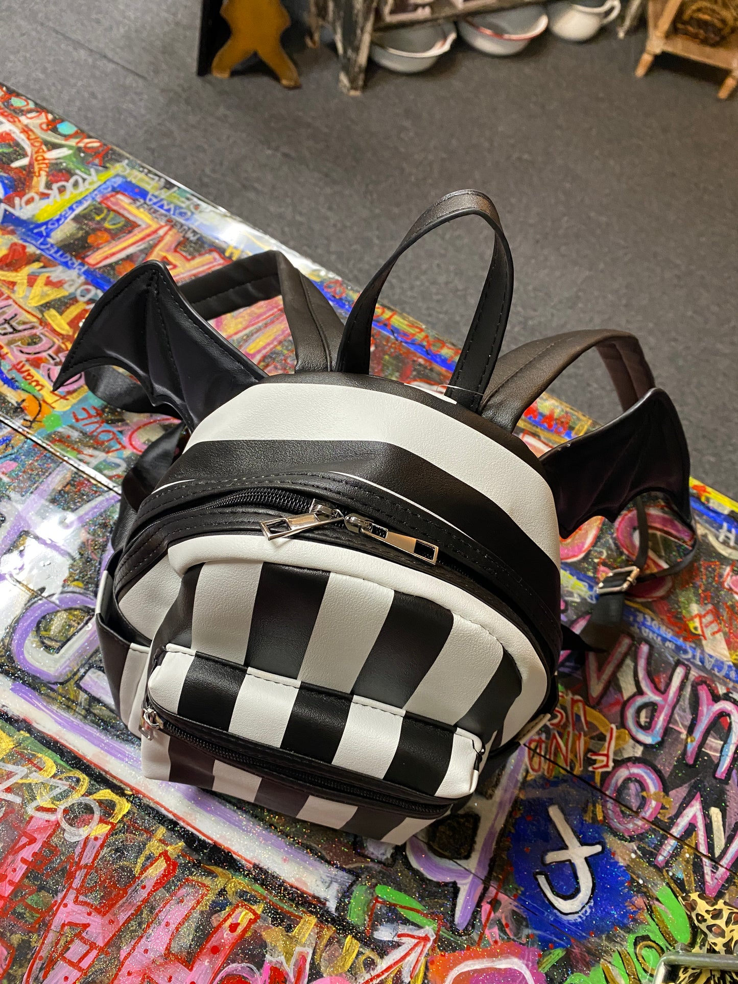 Black and white stripe bat wing backpack