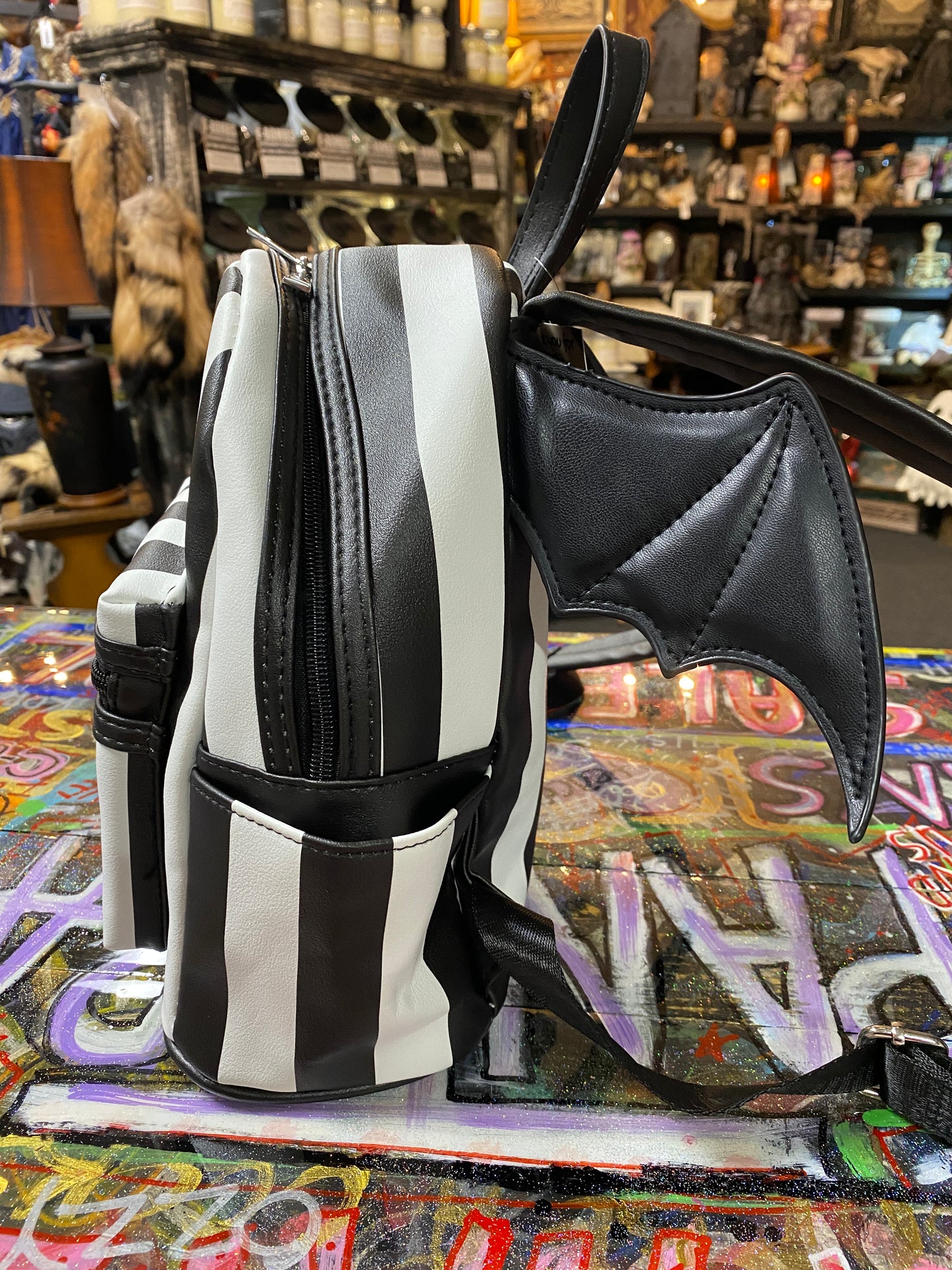 Black and white stripe bat wing backpack